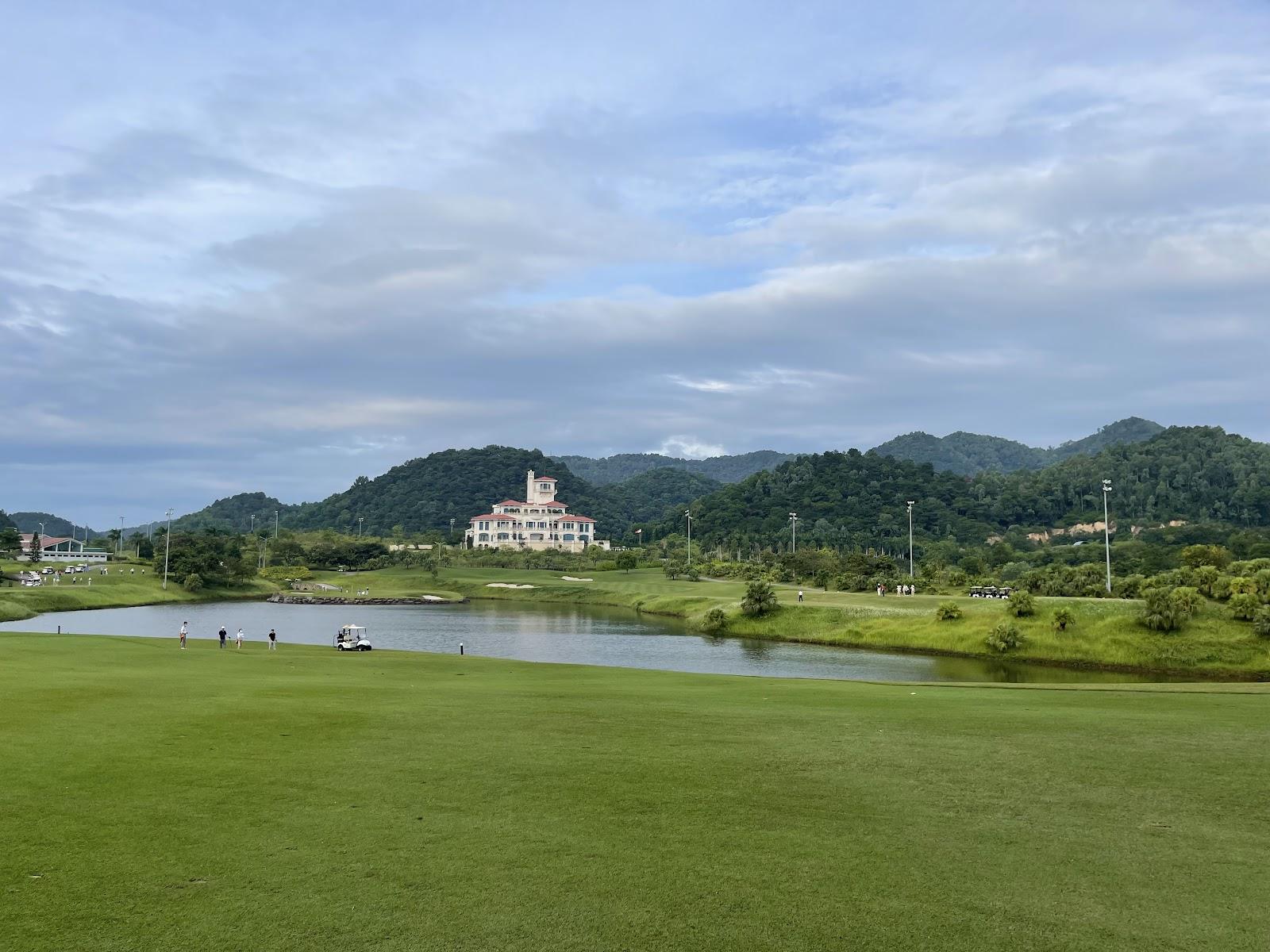Golf course near Hanoi, Vietnam, fairway framed by hills at BRG Legend Hill
