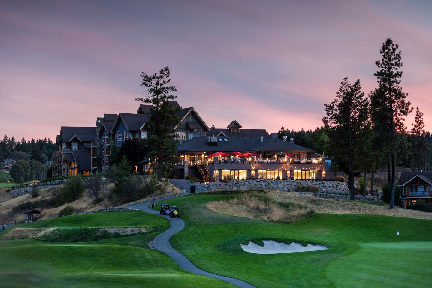 Predator Ridge Resort, Vernon, clubhouse and lodge above the 18th green at dusk
