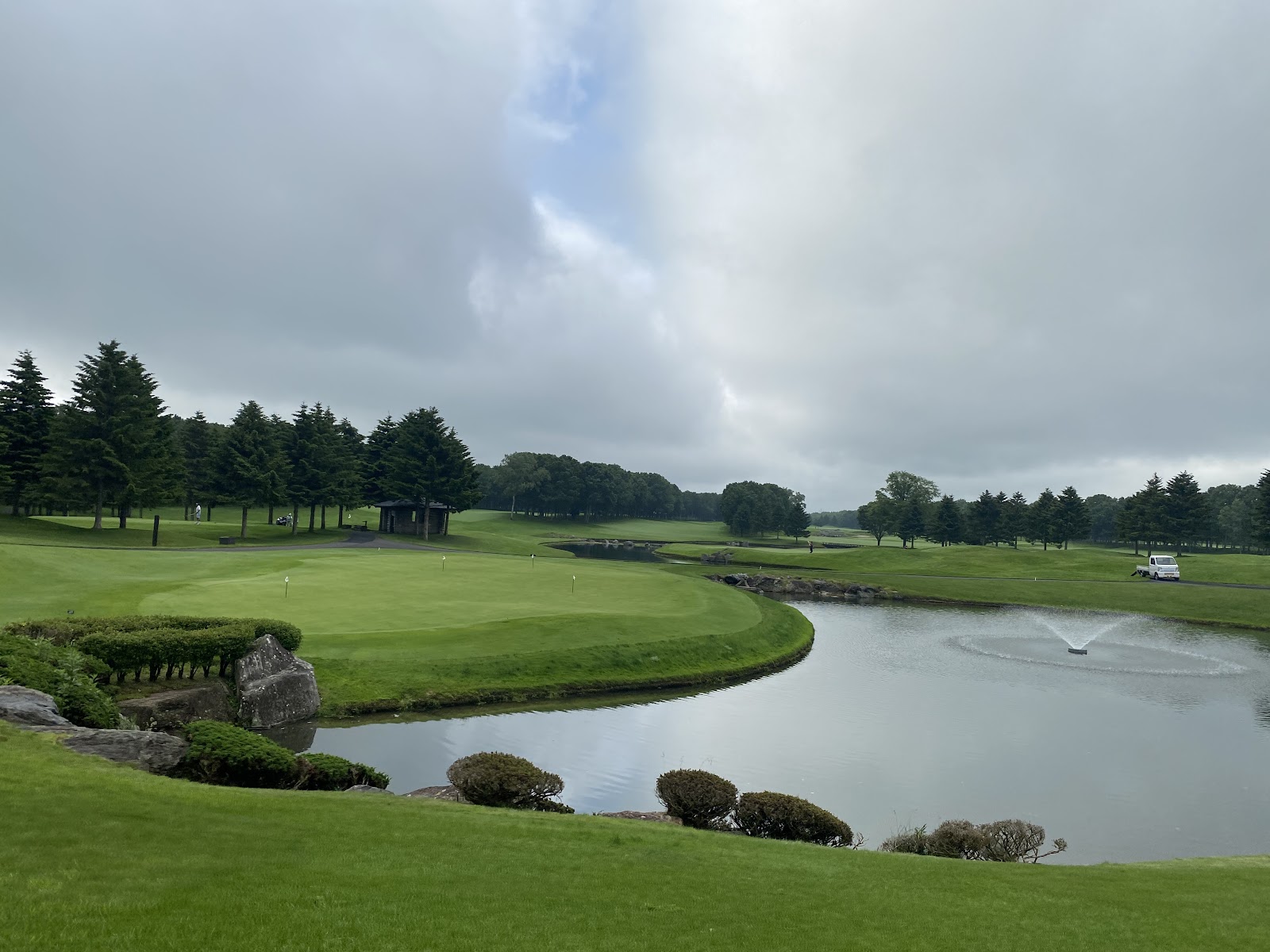 Hokkaido Classic Golf Club, Jack Nicklaus designed fairway framed by forest near Tomakomai, Japan