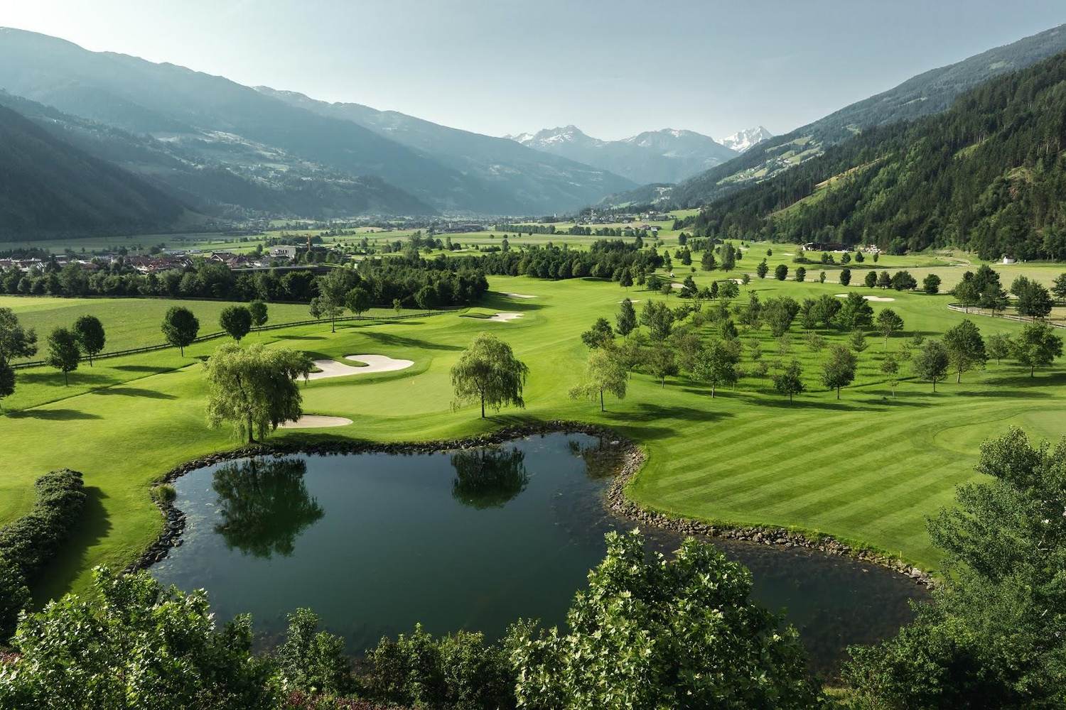 Alpine golf course in Austria under summer light, illustrating the best months to play golf in Austria
