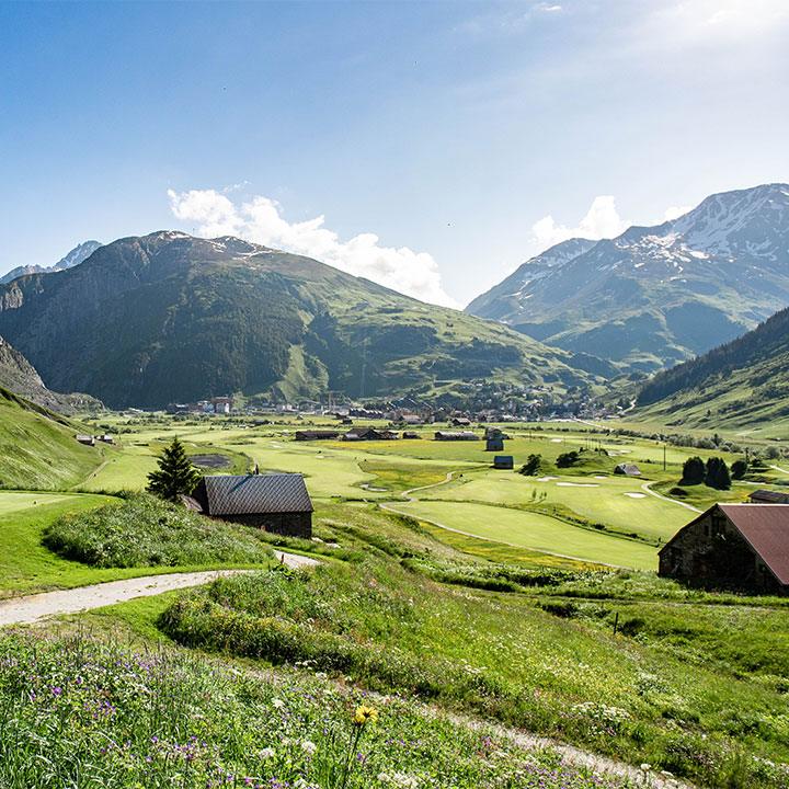 Andermatt Swiss Alps golf course, fairways beneath Alpine peaks