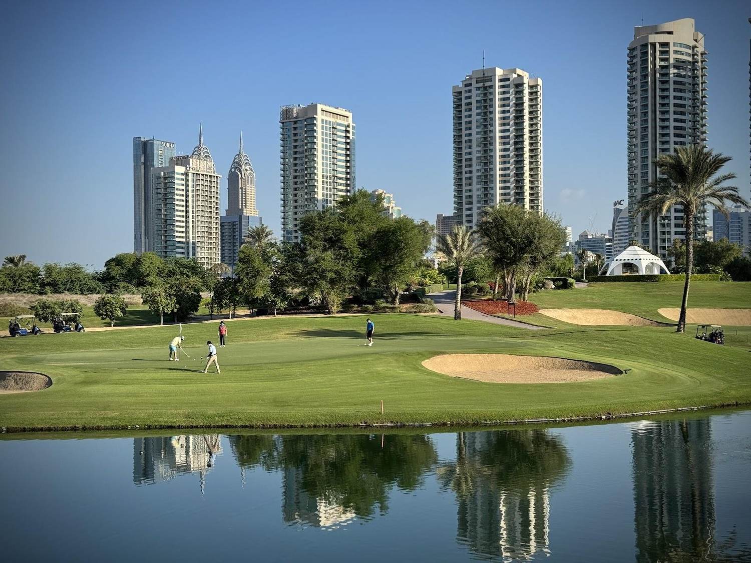 Emirates Golf Club Majlis course with the Dubai skyline behind, United Arab Emirates