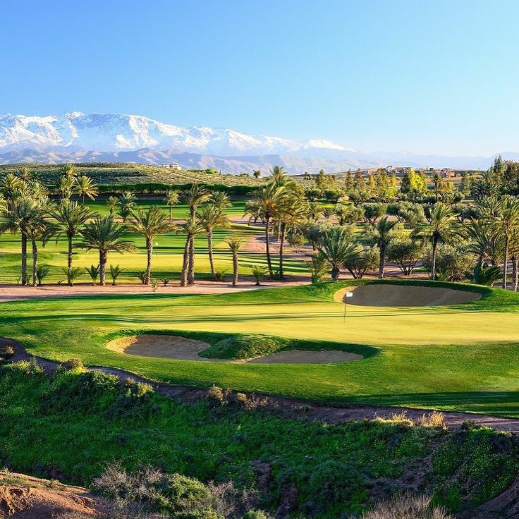 Assoufid Golf Club desert fairways with the High Atlas beyond, Marrakech, Morocco