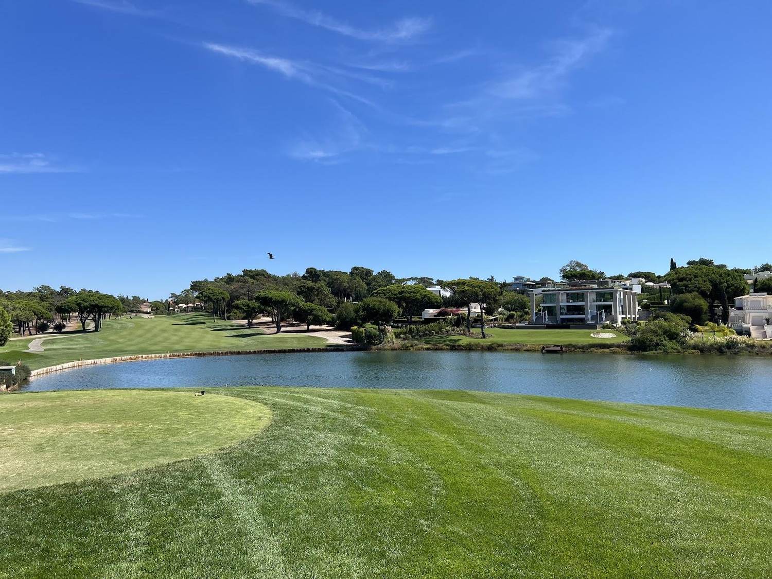 Quinta do Lago golf course, manicured fairway and lake in the Algarve, Portugal