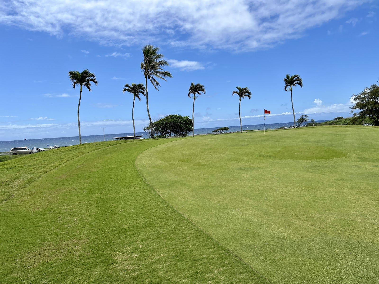 Kapalua Plantation Course, Maui, fairway cascading toward the Pacific with Molokai on the horizon