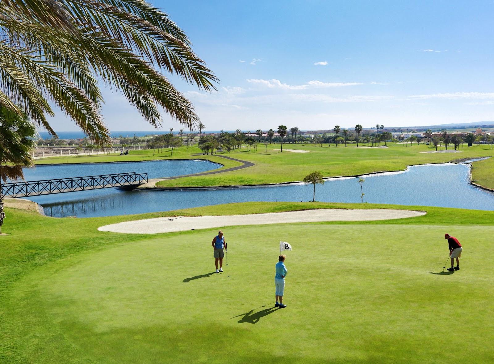 Fuerteventura Golf Club fairway with the Canary Islands coastline beyond